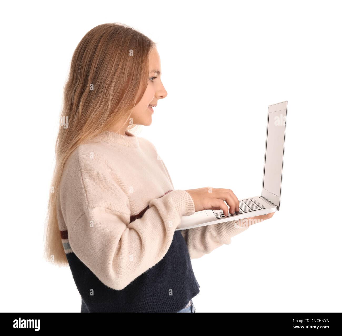 Little girl using laptop on white background Stock Photo - Alamy