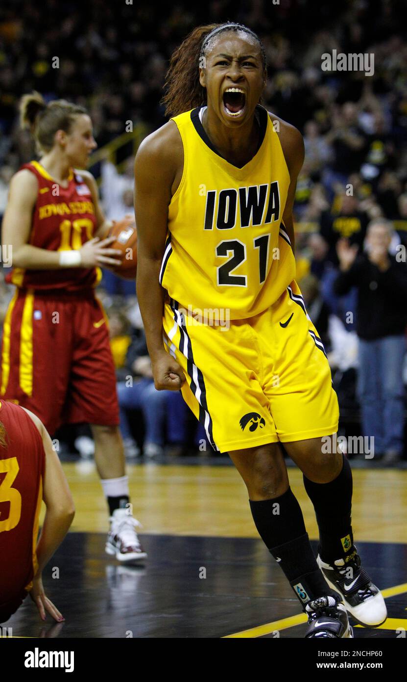 Iowa guard Kachine Alexander, right, reacts after making a basket