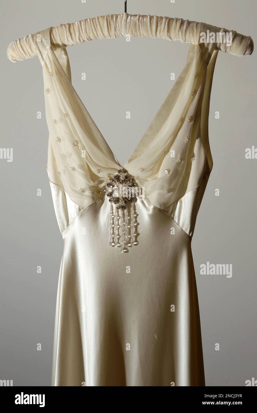 This Tuesday, Nov. 23, 2010 photo shows beading and material contribute to  the vintage look of this Jenny Packham wedding dress at Mark Ingram Bridal  Atelier in New York. Some brides like