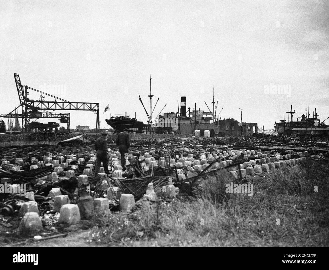 Danzig Ship Two Americans pick their way through the wreckage which was once a ...