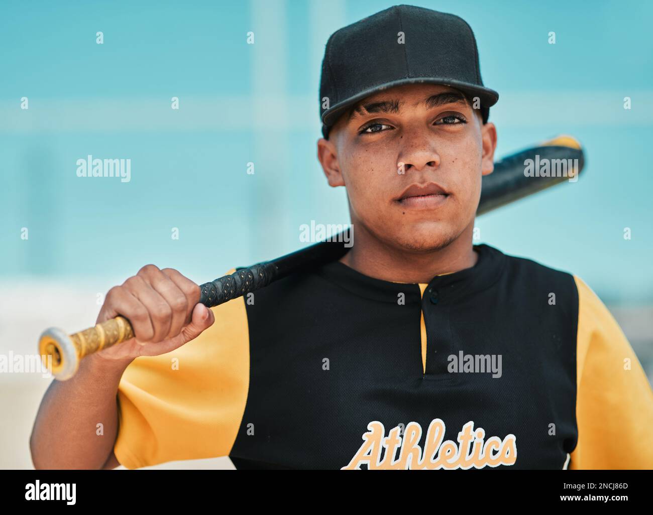 Baseball player posing with bat Stock Photo - Alamy