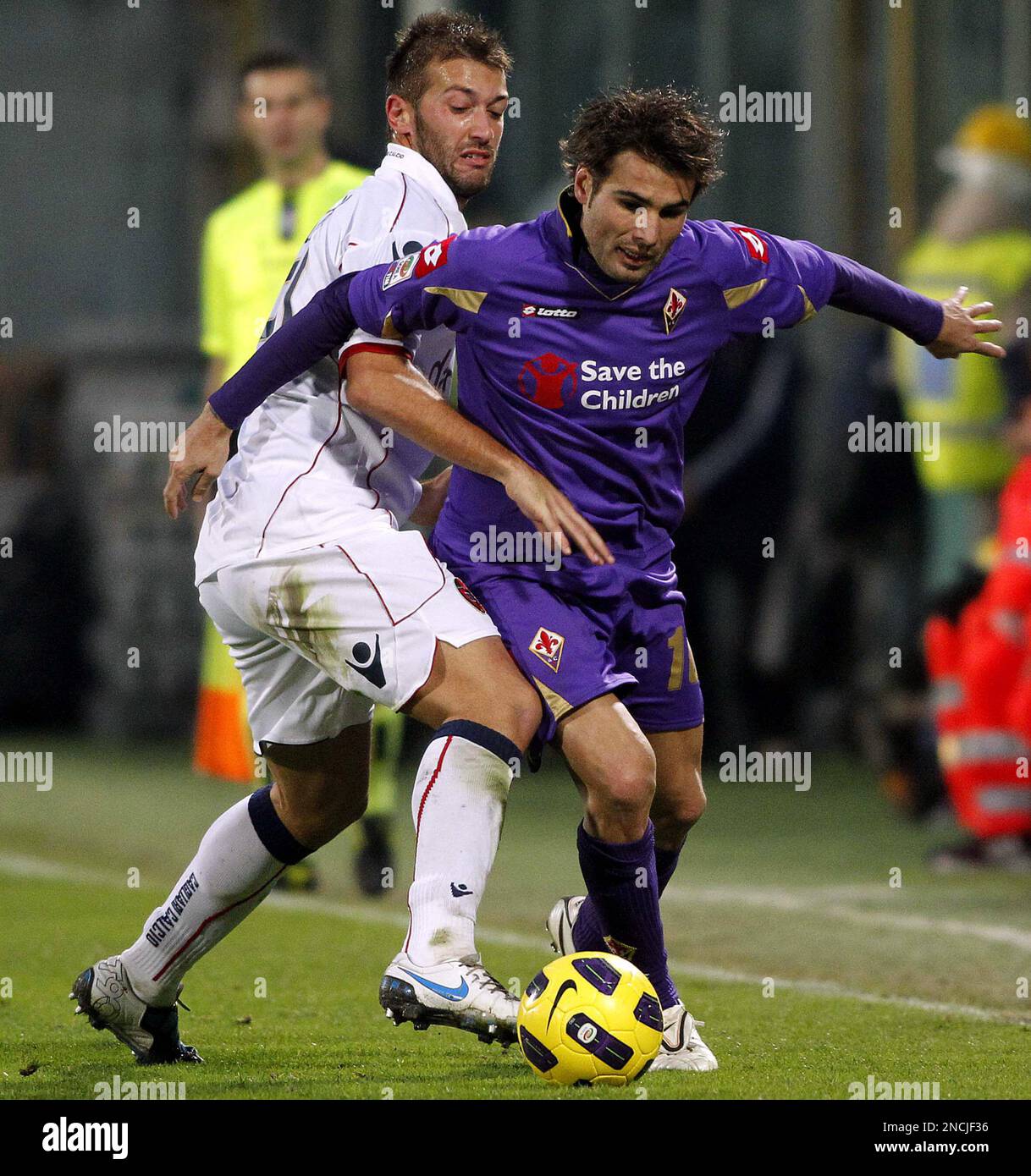 Fiorentina's Adrian Mutu of Romania, right, is challenged by Cagliari's  Michele Canini during a Serie A soccer match at the Artemio Franchi stadium  in Florence, Italy, Sunday, Dec. 5, 2010. Fiorentina won