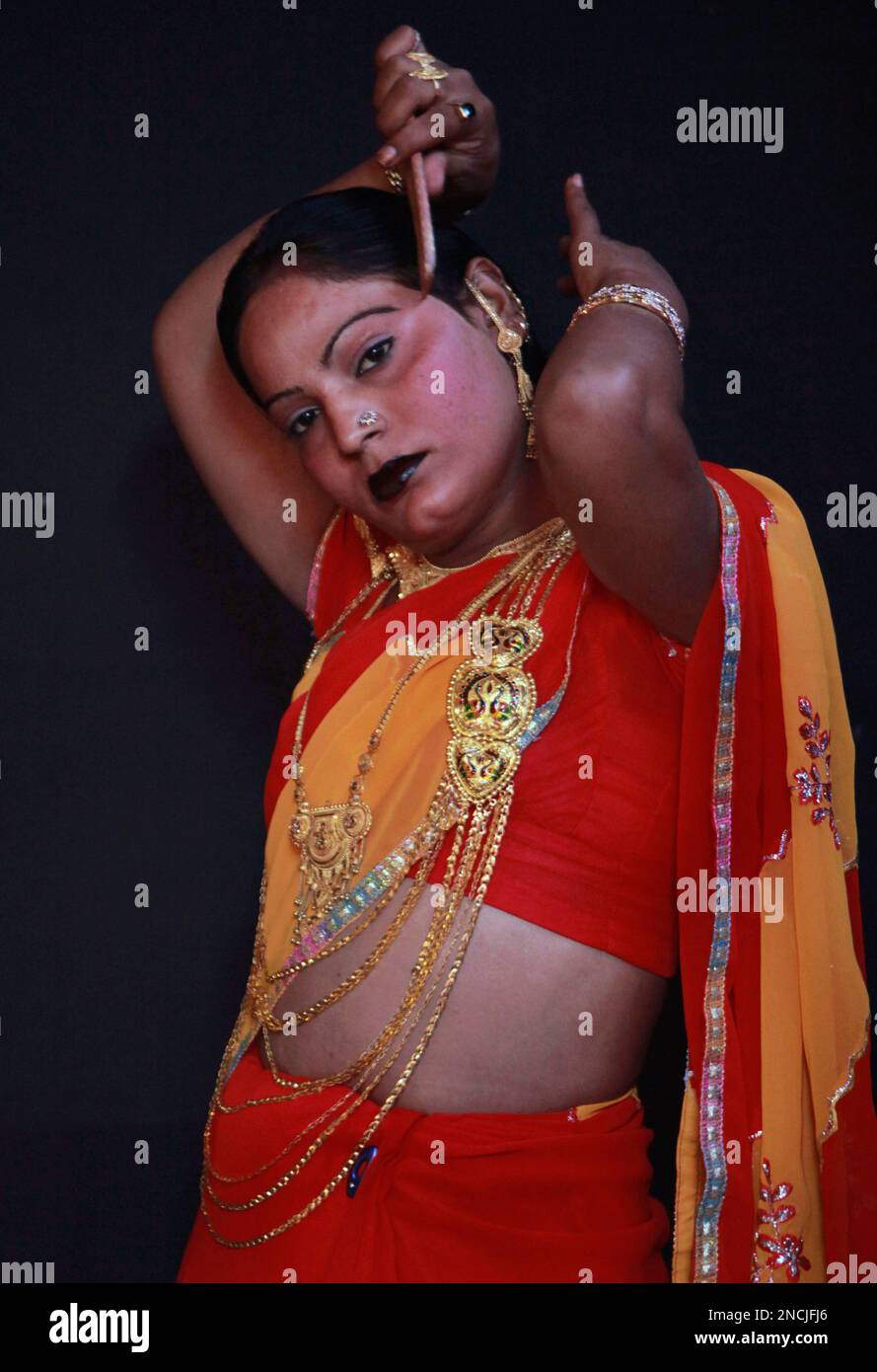 In this photo taken Saturday, Dec. 4, 2010, a eunuch dresses up for a rally  to mark the congregation of thousands of eunuchs from different parts of  India and Pakistan in Jammu,