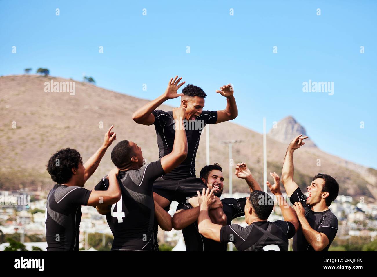 Winning gives you wings. a group of young rugby players celebrating ...