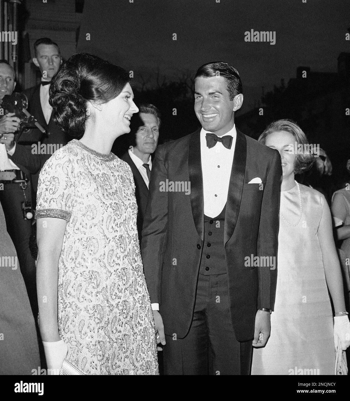 Lynda Bird Johnson and actor George Hamilton, her frequent escort, arrive  at a wedding eve party for her sister Luci and fiancé Patrick Nugent at an  exclusive club in the Georgetown section