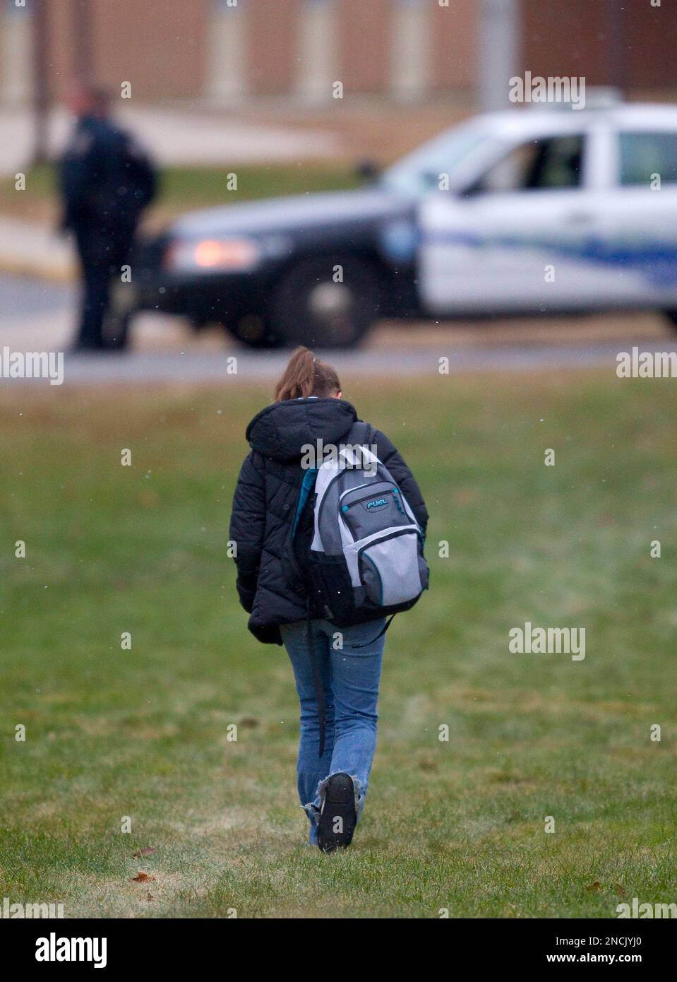 A student at Marinette High School arrives for class Wednesday morning ...