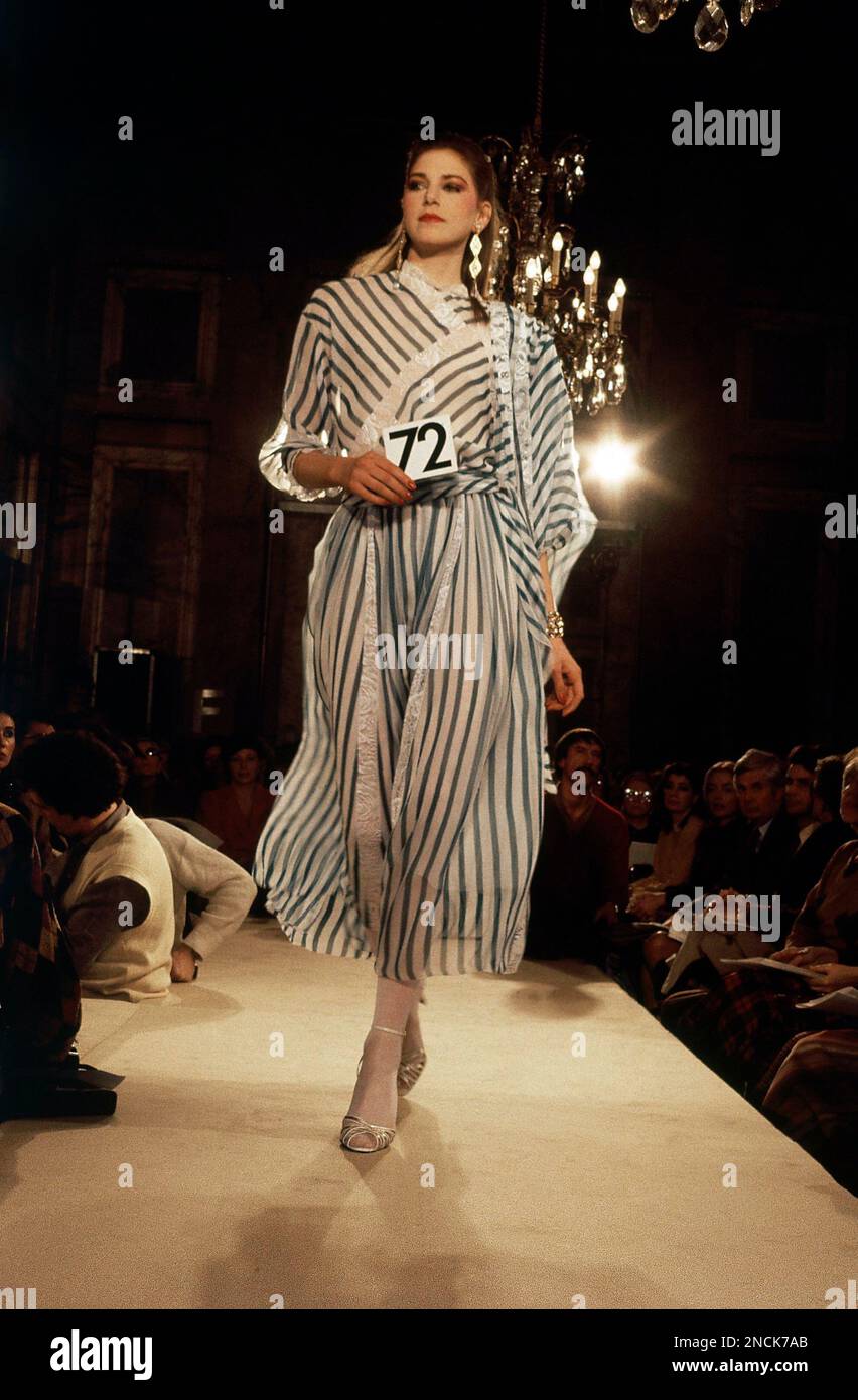 On Christian Dior fashion show for his 1982 Spring-Summer Haute Couture Collection which took place in Paris, Jan. 25, 1982. A dress with white and blue stripes muslin. (AP Photo/Levy Stock Photo - On Christian Dior fashion show for his 1982 Spring-Summer Haute Couture Collection which took place in Paris, Jan. 25, 1982. A dress with white and blue stripes muslin. (AP Photo/Levy Stock Photo -