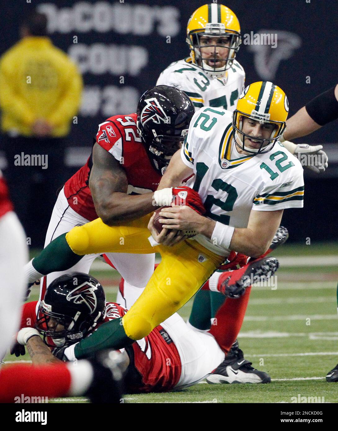 Green Bay Packers Quarterback Aaron Rodgers (12) Is Stopped By Atlanta 