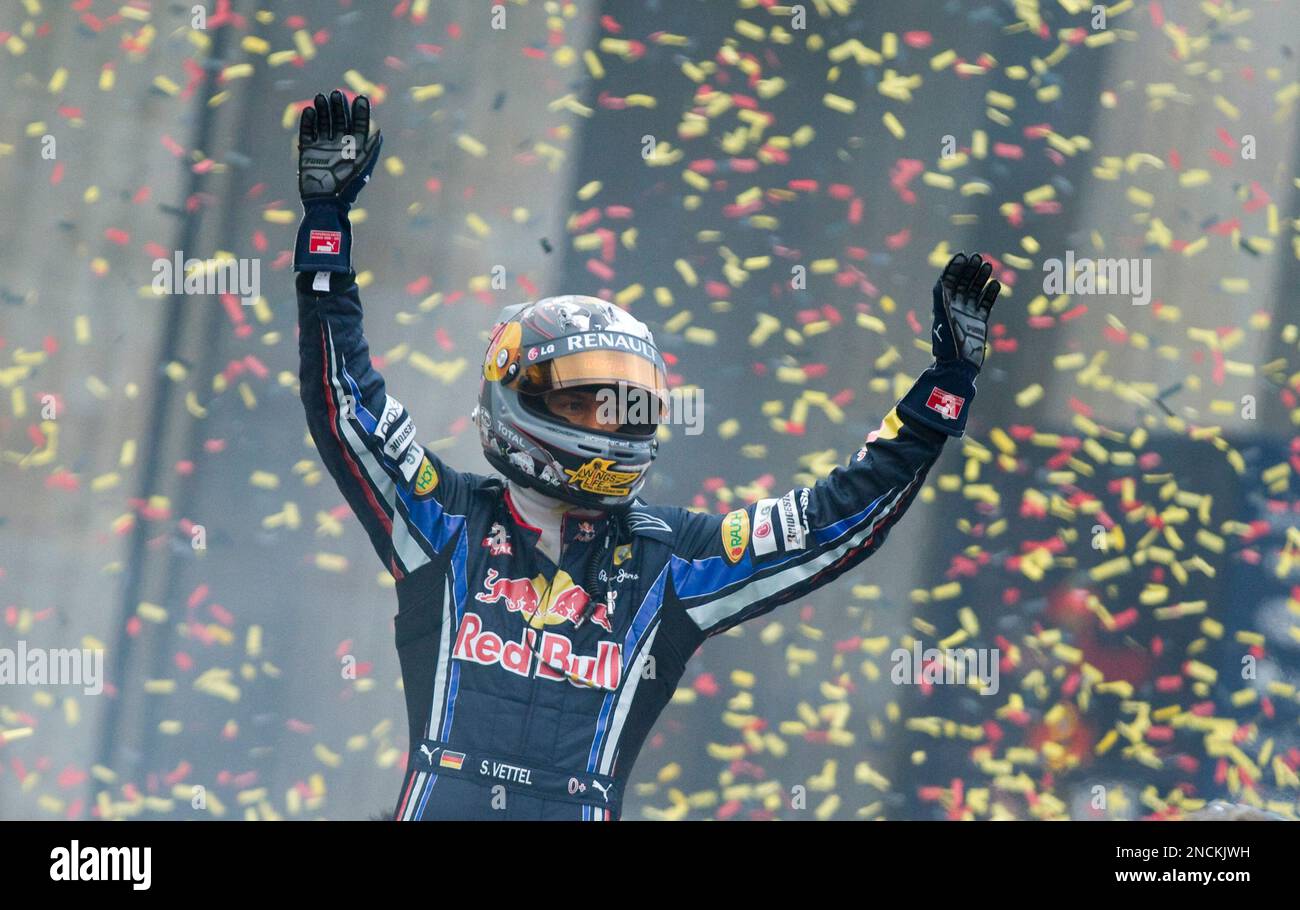 Seb Vettel 2010 Red Bull driver Sebastian Vettel of Germany waves to the crowd in front ...