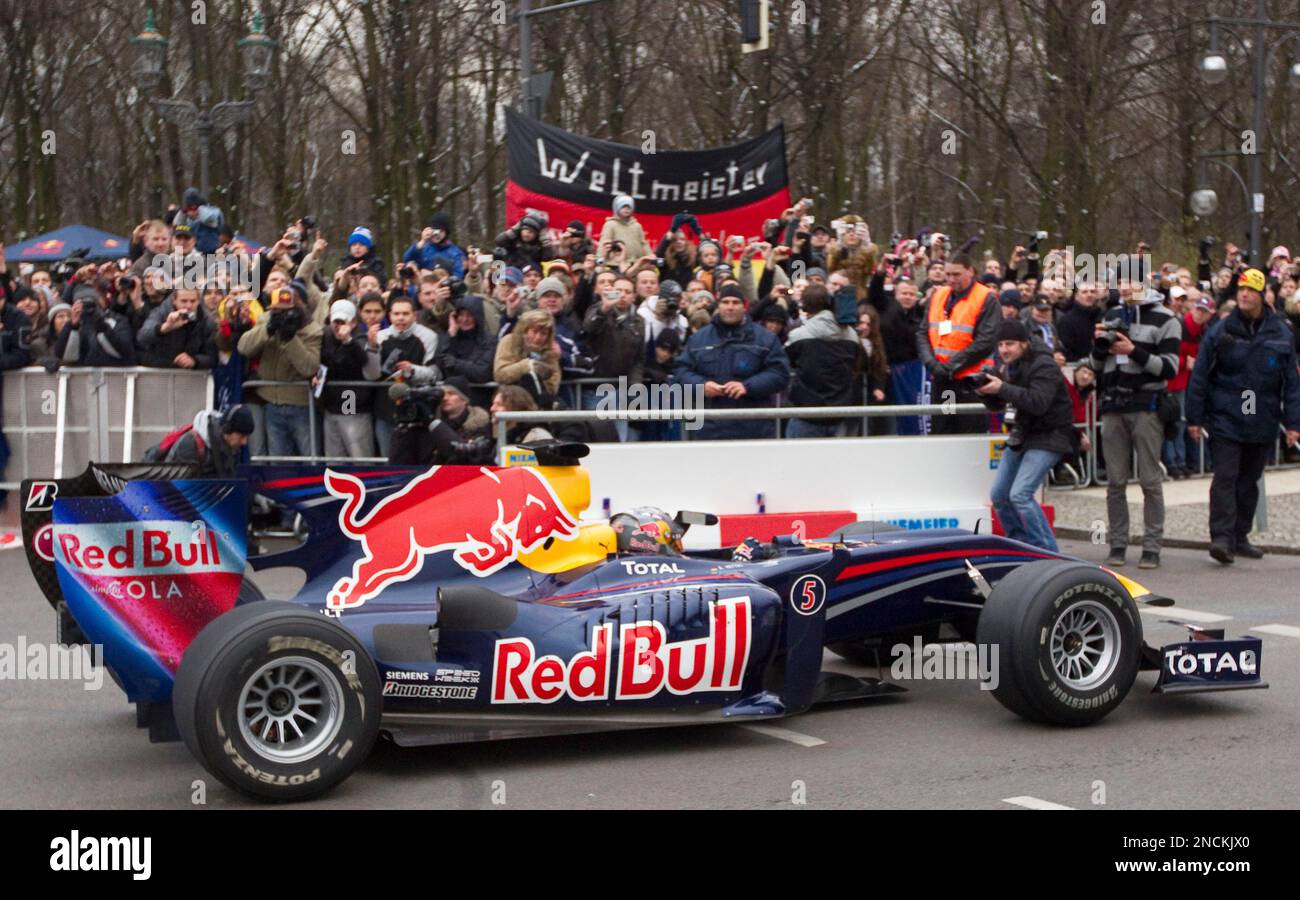 Red Bull driver Sebastian Vettel of Germany celebrates on his car