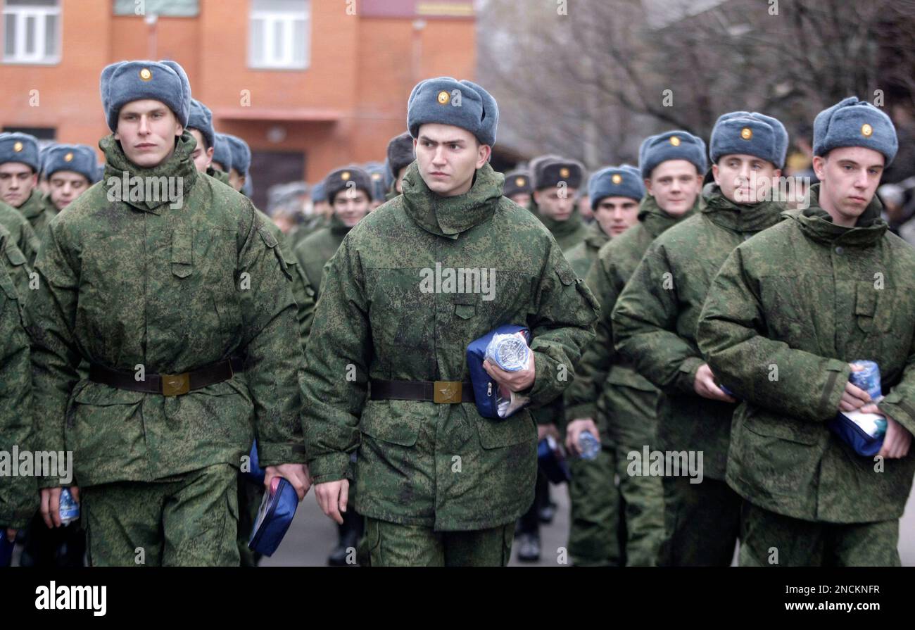 Russian military conscripts march at a conscription point in downtown ...