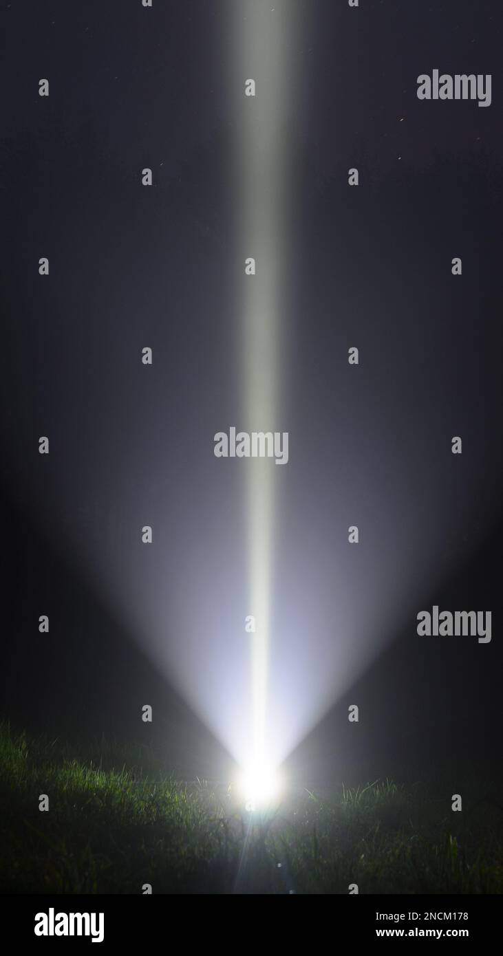 Bright beam led flashlight travel vertically from the lamp shines on
