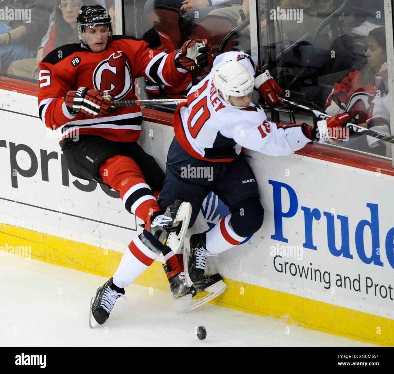 New Jersey Devils Colin White (5) and Tampa Bay Lightning Jason Ward (16)  battle for the puck during the first period at the Continental Airlines  Arena in East Rutherford New Jersey on