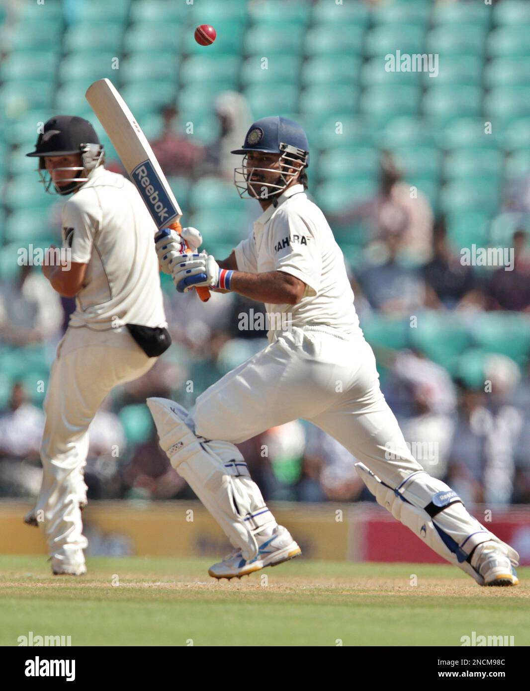 India's Captain Mahendra Singh Dhoni, Right, Plays A Shot As New ...