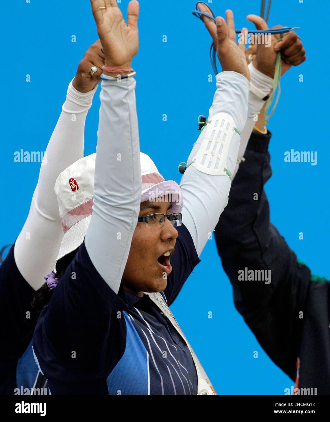 Indian archers Dola Banerjee celebrates with team mates after learning
