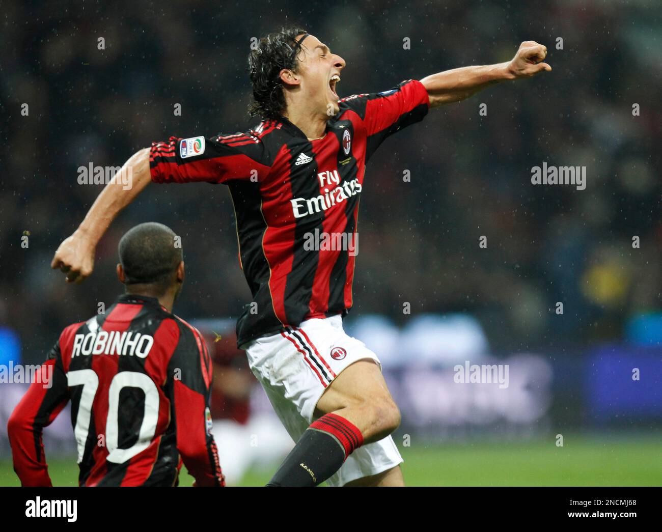 AC Milan forward Zlatan Ibrahimovic of Sweden, right, celebrates with his  teammate Brazilian forward Robinho after scoring during a Serie A soccer  match between AC Milan and Fiorentina at the San Siro