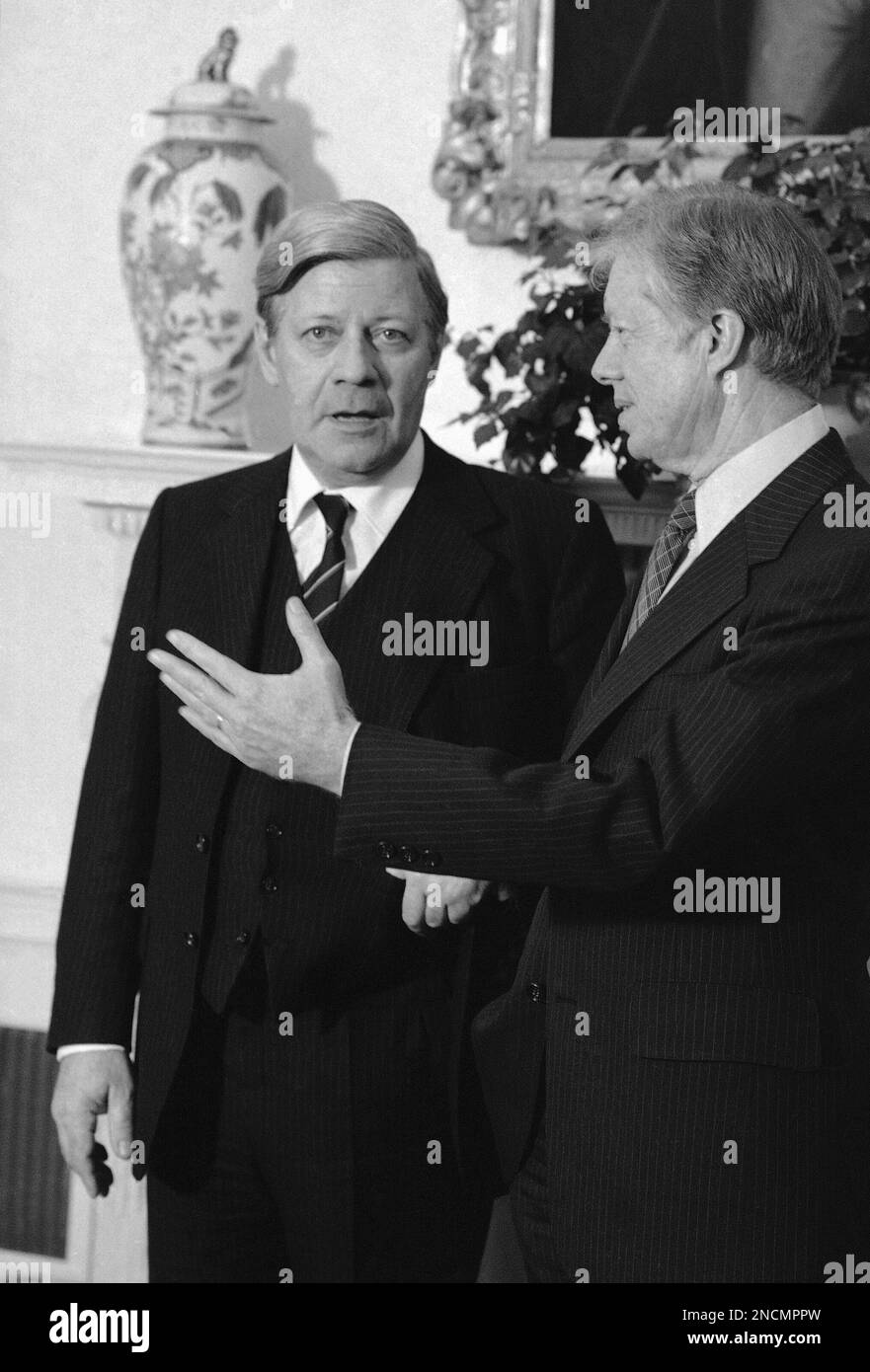 President Jimmy Carter greats West German Chancellor Helmut Schmidt in the Oval Office of the