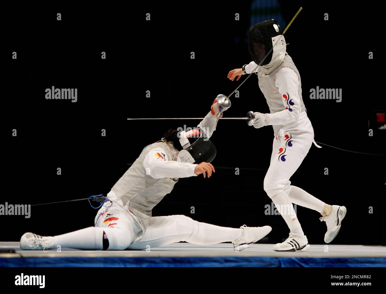 China's Chen Jinyan, left fights South Korea's Nam Hyun Hee during the