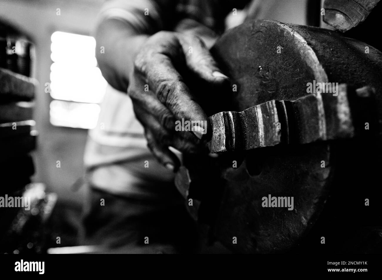 A Hand of a man calibrating a machine Stock Photo Alamy