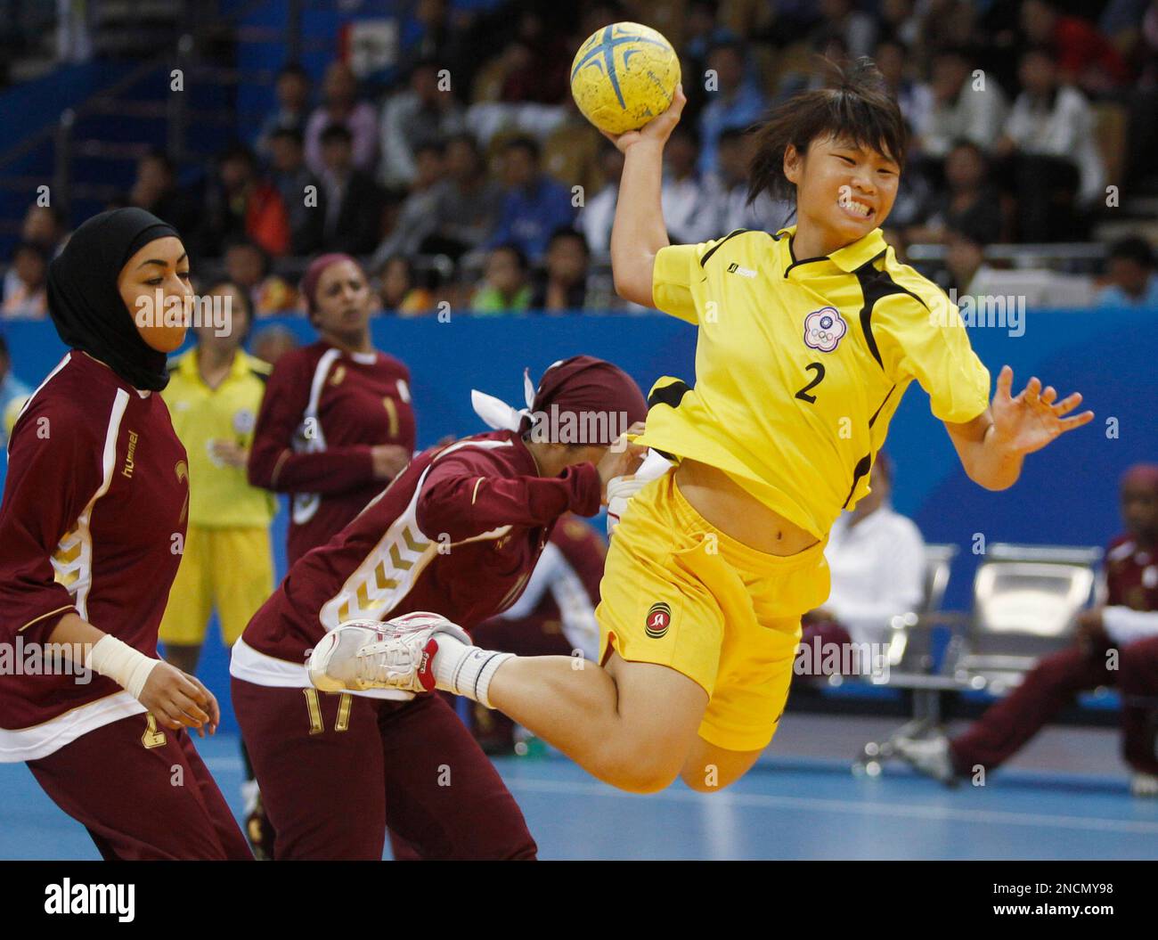 Taiwan's Chien Chen Chen shoots past Qatar's Sara Abdulrahman Al