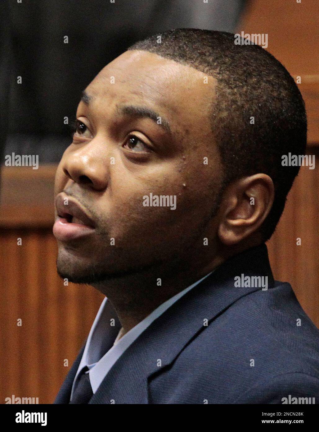 Murder defendant Courtney Lockhart listens during opening statements