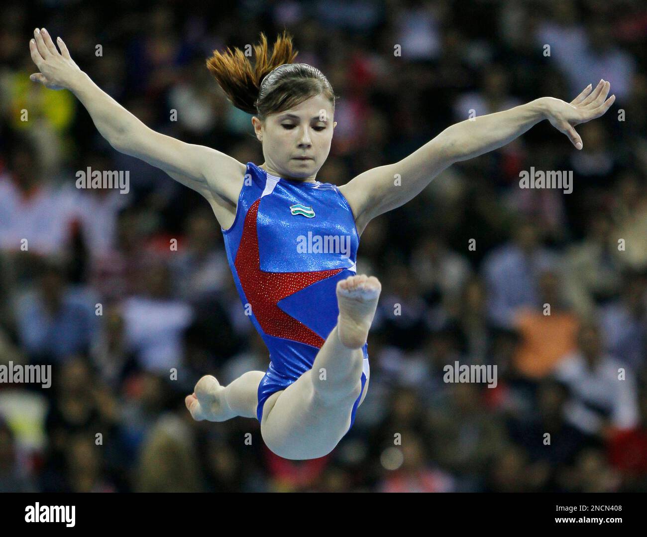 Uzbekistan's Luiza Galiulina performs on the beam during the women's