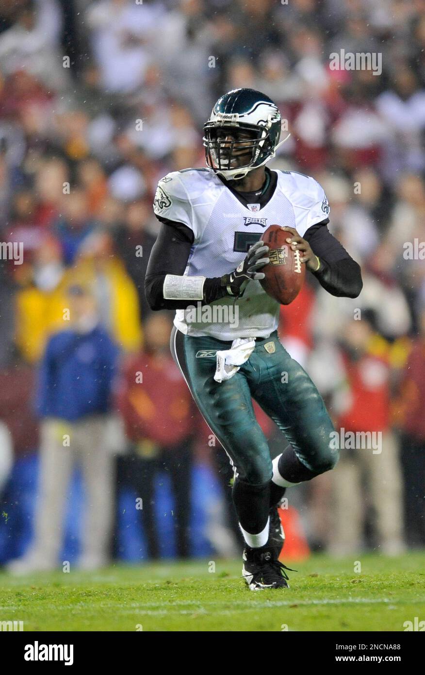 Philadelphia Eagles quarterback Michael Vick (7) rolls out to pass