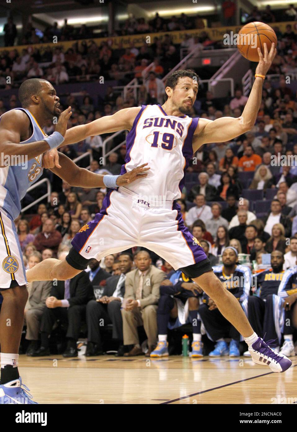 Phoenix Suns' Hedo Turkoglu (19), of Turkey, saves the ball before going  out-of-bounds as Denver Nuggets' Shelden Williams defends during the first  quarter of an NBA basketball game Monday, Nov. 15, 2010,