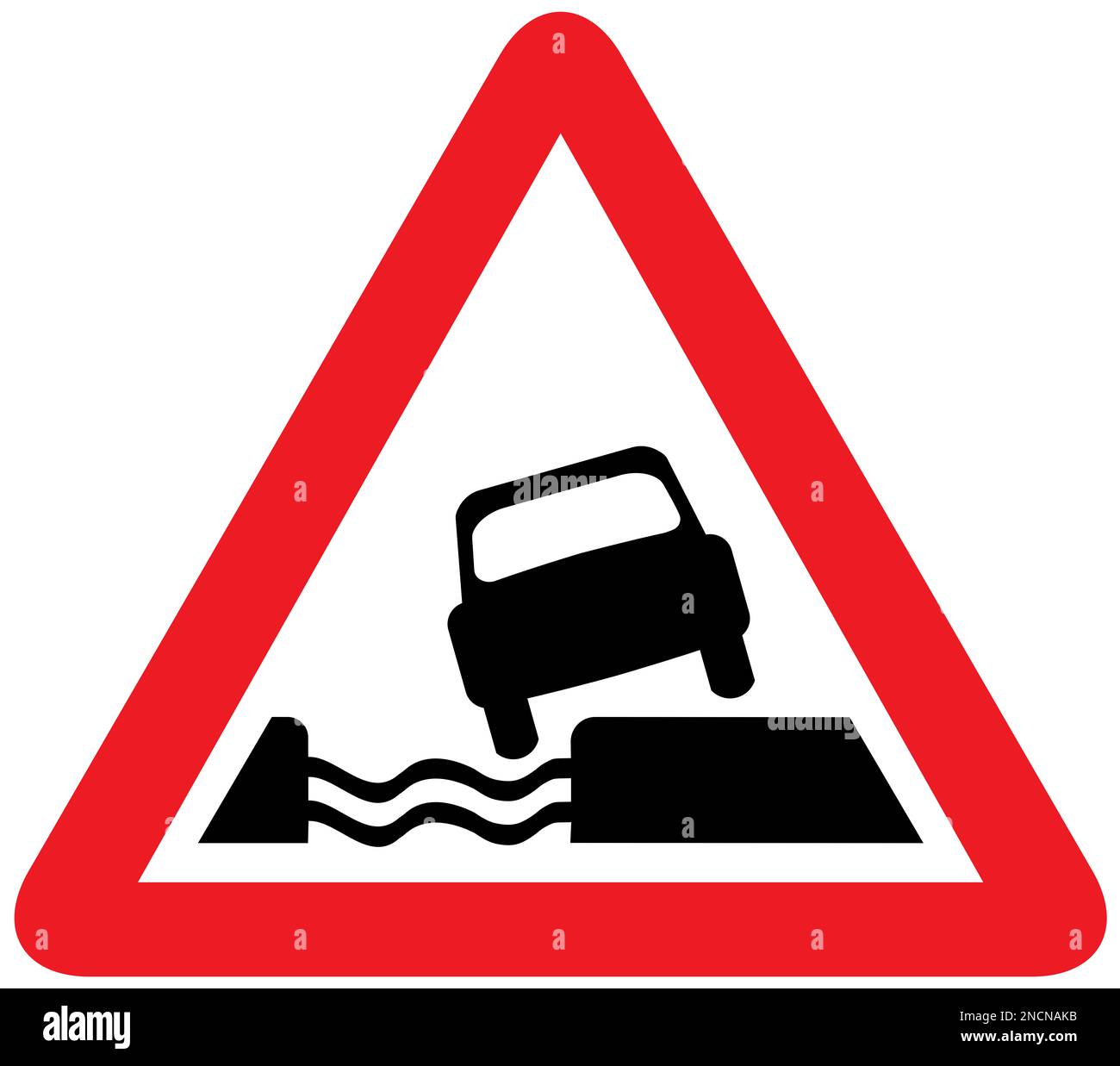 Water course alongside road ahead British road sign Stock Photo