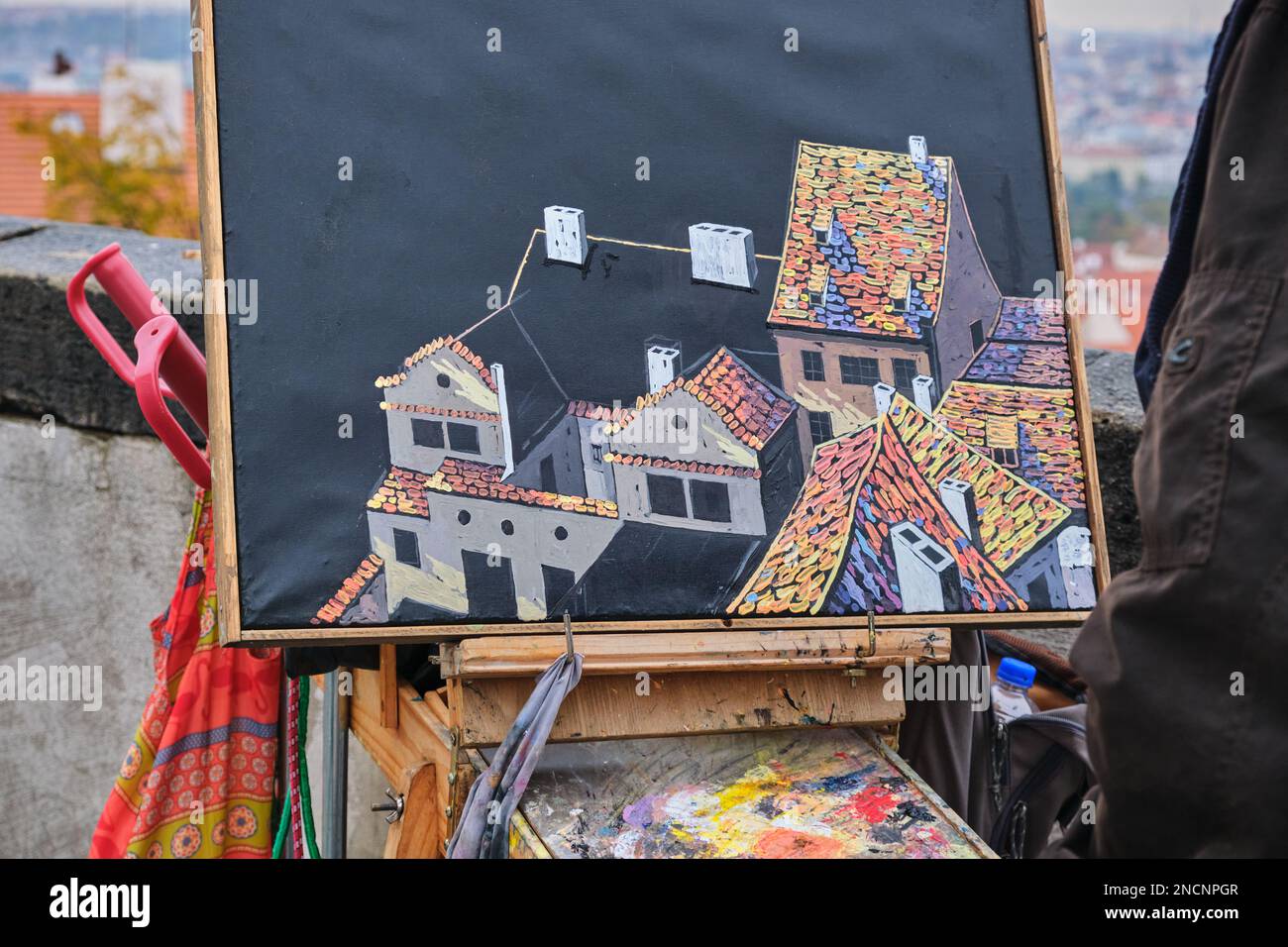 artist paints on canvas a city landscape architecture. Artist drawing city buildings  Stock Photo