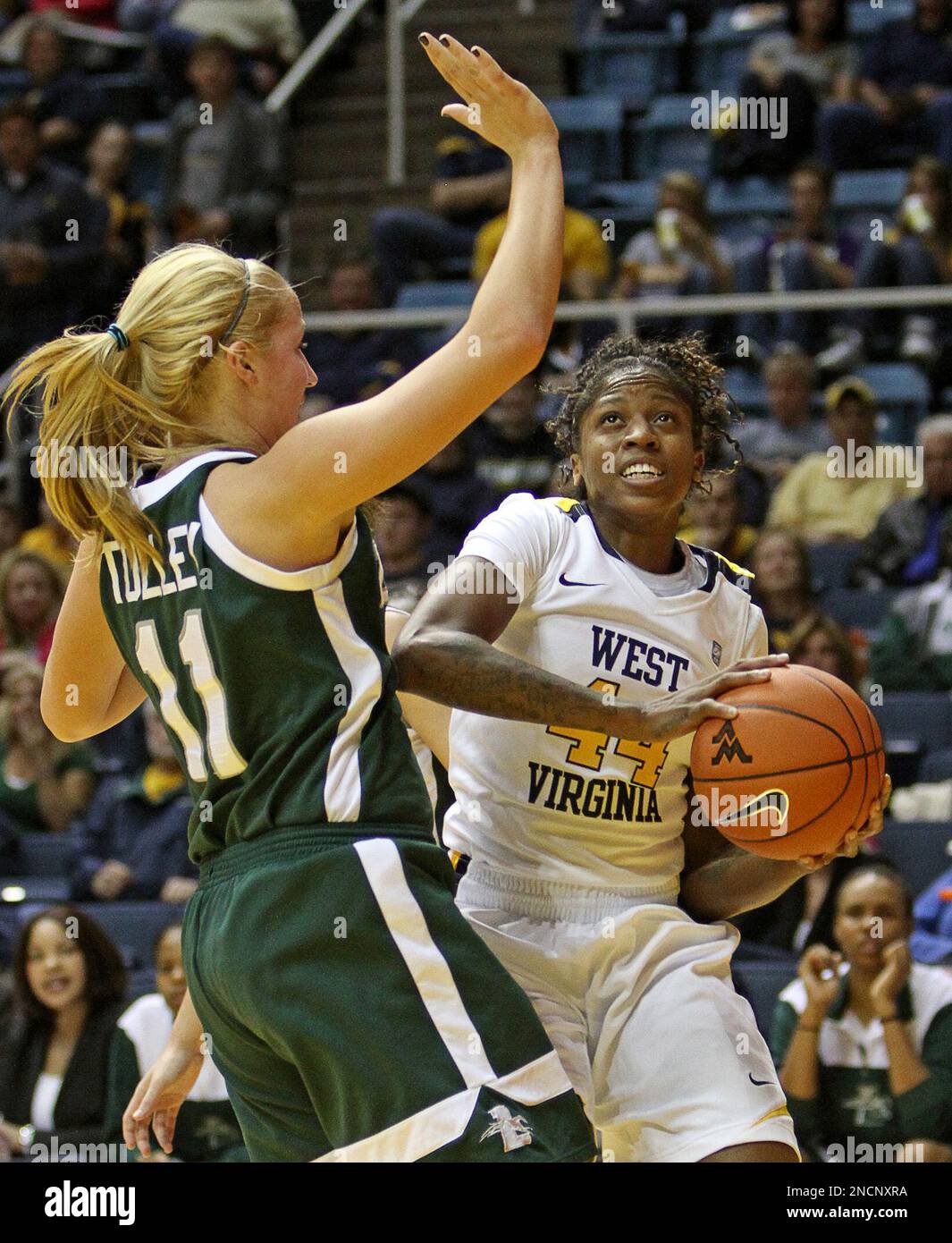 West Virginia's Madina Ali, right, is defended by Loyola, Md.'s ...