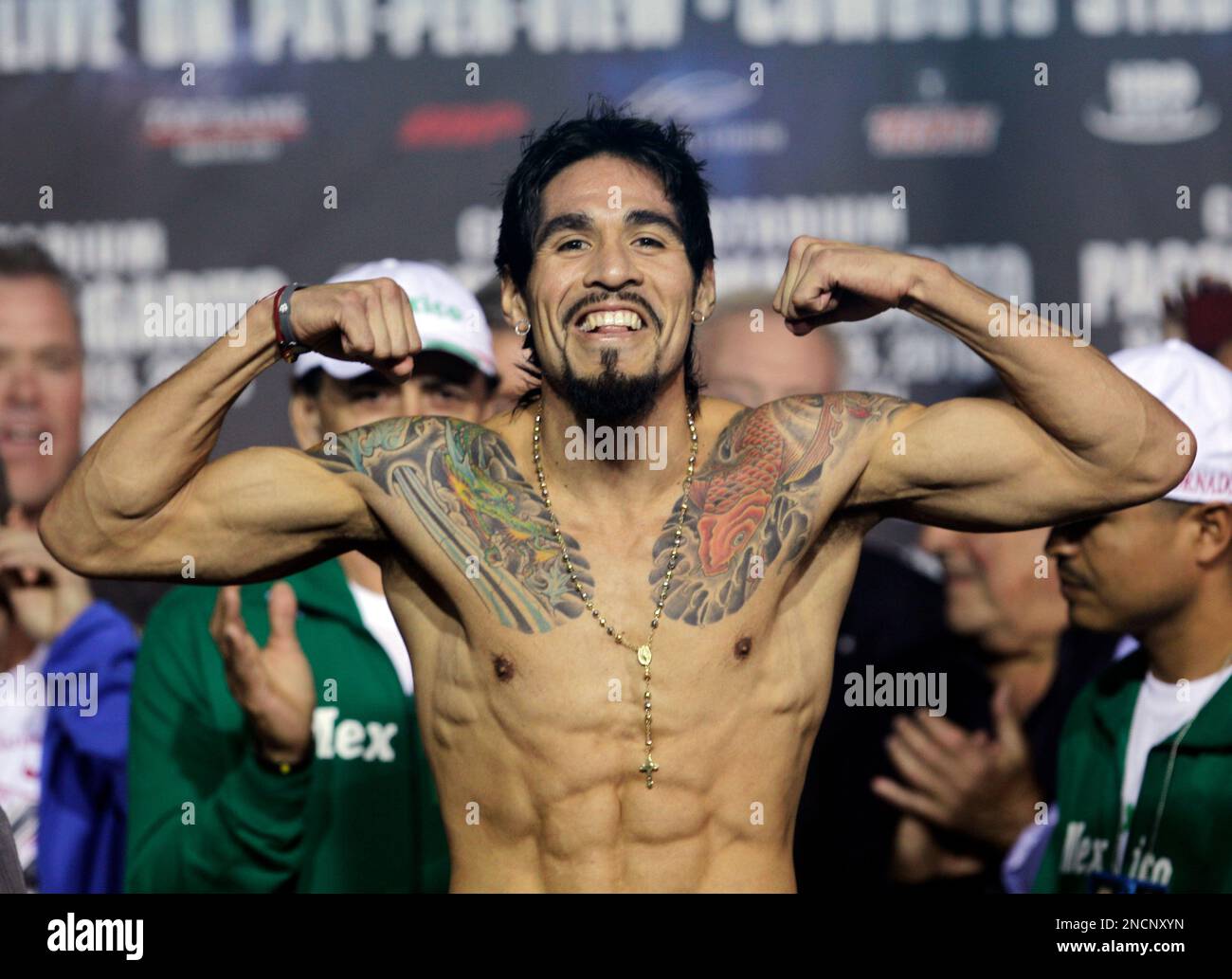 Antonio Margarito, of Mexico, flexes as he stands on the scale during the  weigh-in ceremony for his fight against Manny Pacquiao, of the Philippines,  Friday, Nov. 12, 2010, in Arlington, Texas. The