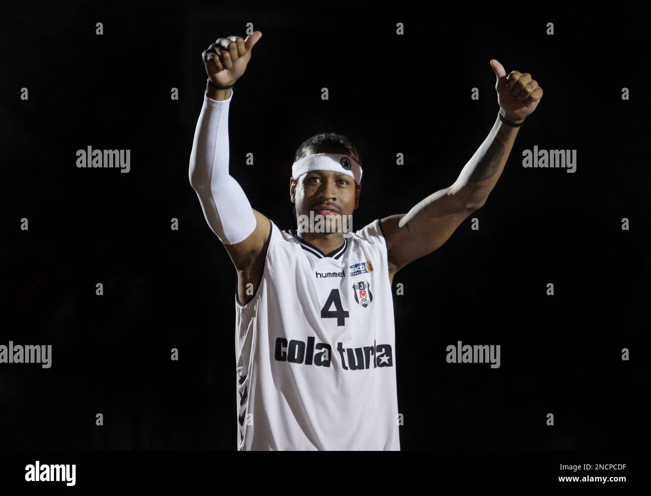 Former NBA player Allen Iverson gestures to cheering supporters of his new  club Besiktas, during a welcome ceremony in Istanbul, Turkey, Tuesday, Nov.  9, 2010. Iverson signed a two-year $4 million contract