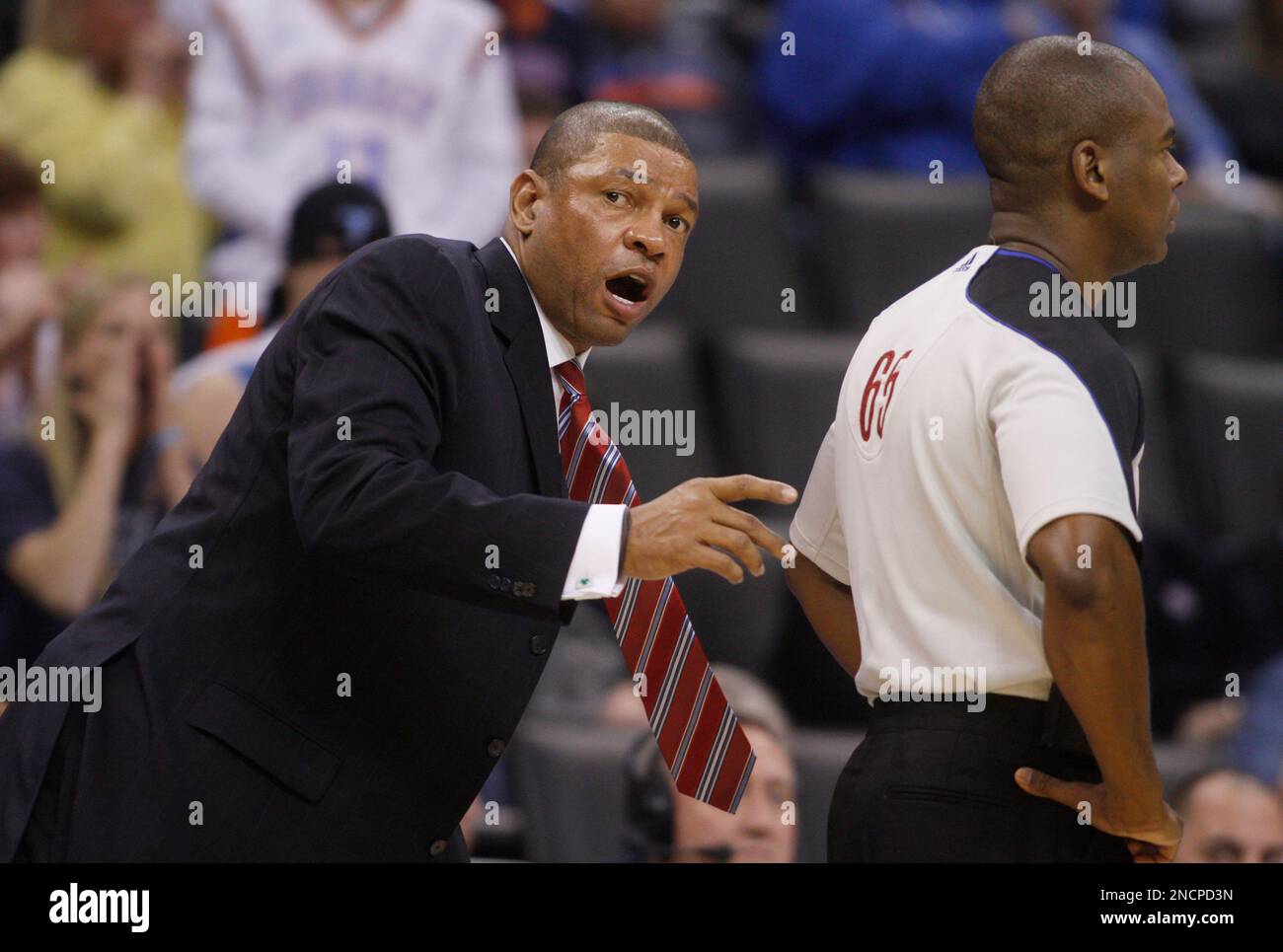 Boston Celtics head coach Doc Rivers, left, official Sean Wright, right