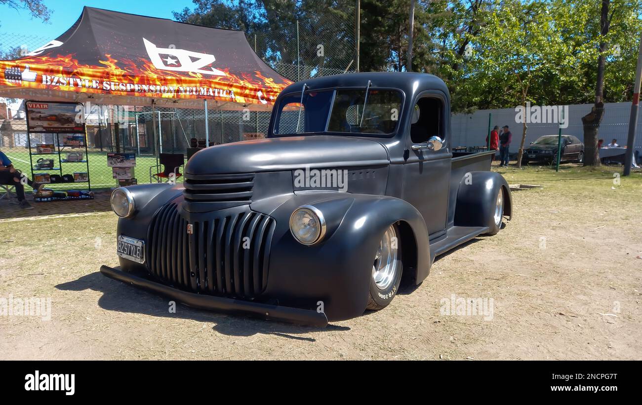 old black 1940s Chevrolet Chevy AK series pickup truck custom lowrider in a park. AAA 2022 classic car show. Stock Photo