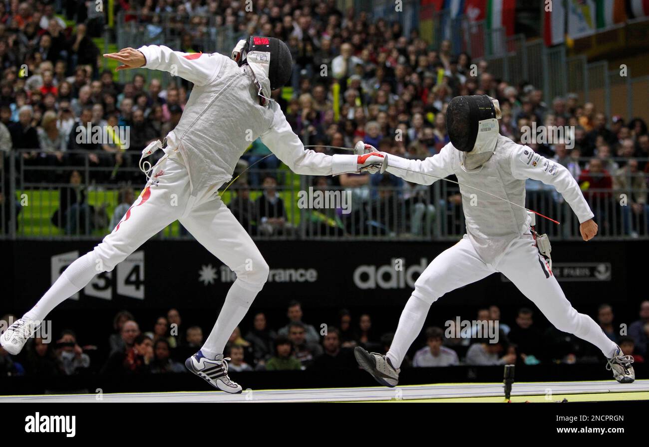 Germany's Peter Joppich, right, competes with China's Lei Sheng in the ...
