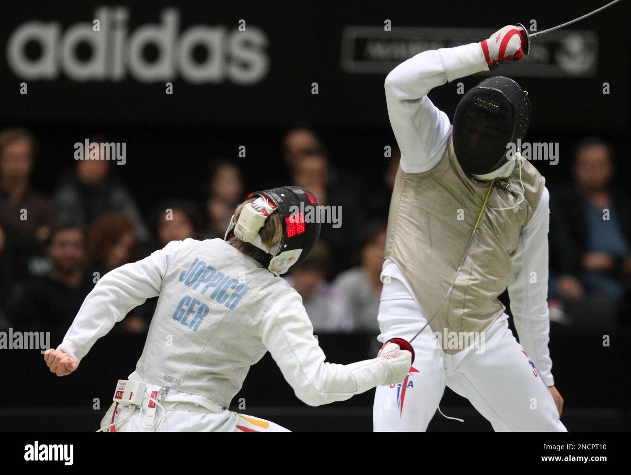 Germany's Peter Joppich, left, competes with USA's Gerek Meinhardt in a