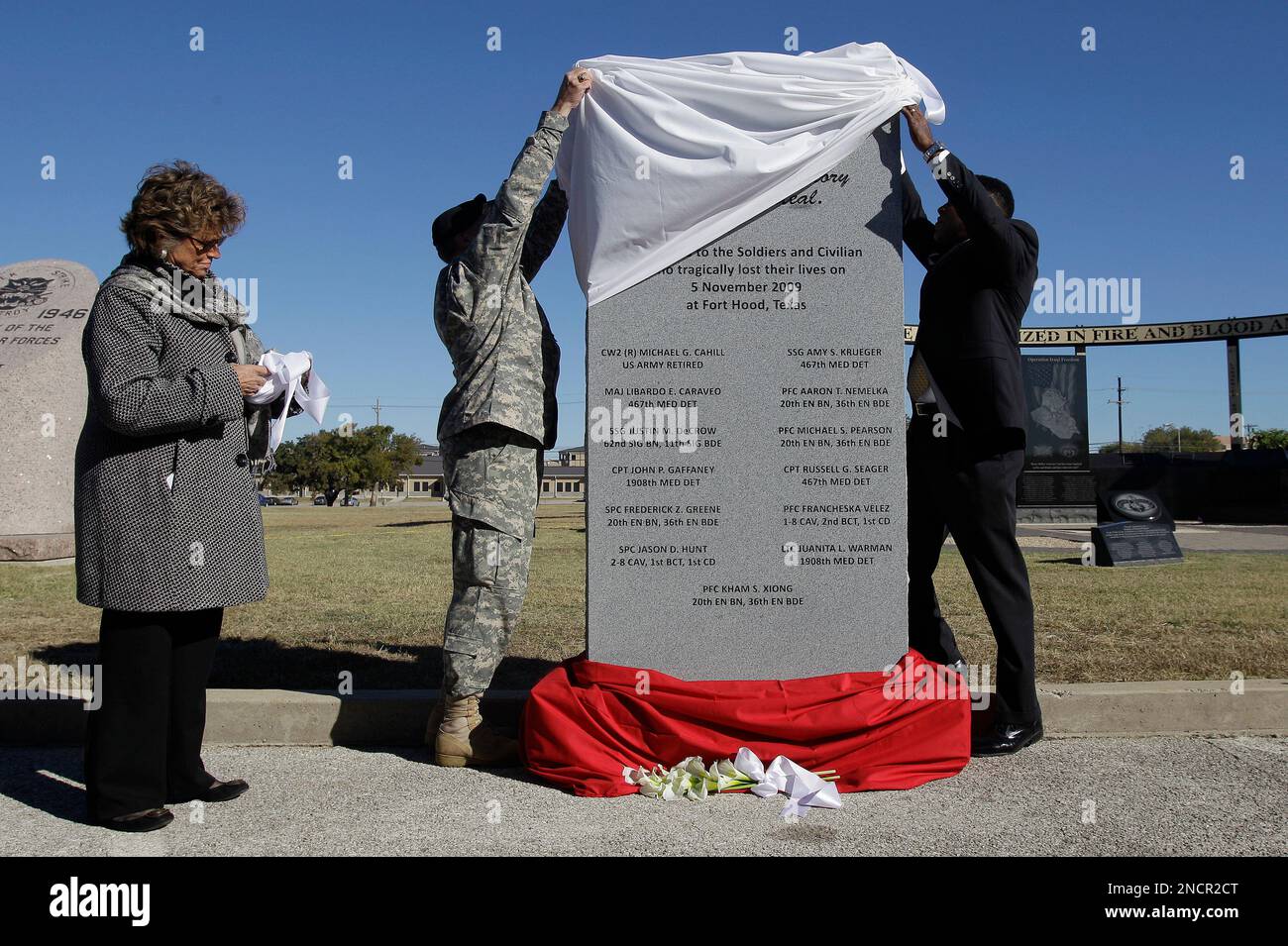 A memorial stone is unveiled during an awards ceremony and memorial ...
