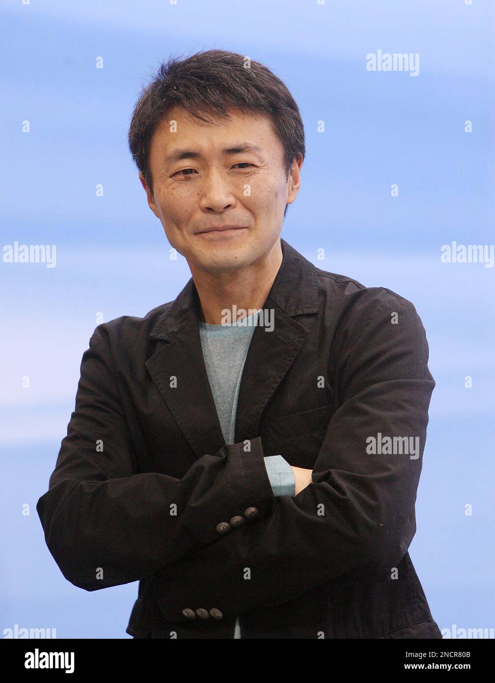 Gran Turismo creator Kazunori Yamauchi checks out finalist vehicles at