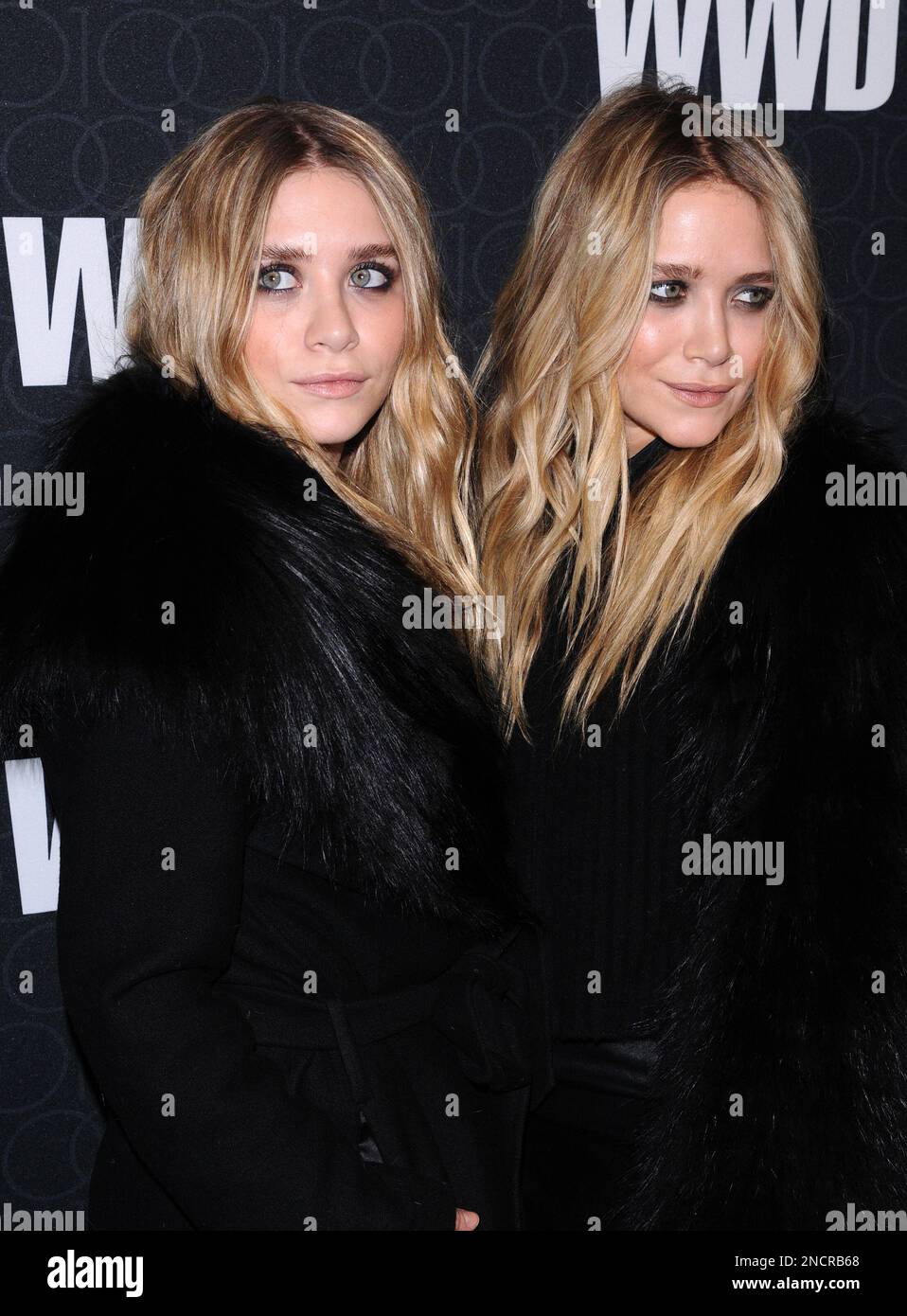 Ashley Olsen and Mary-Kate Olsen attend the Women's Wear Daily 100th ...