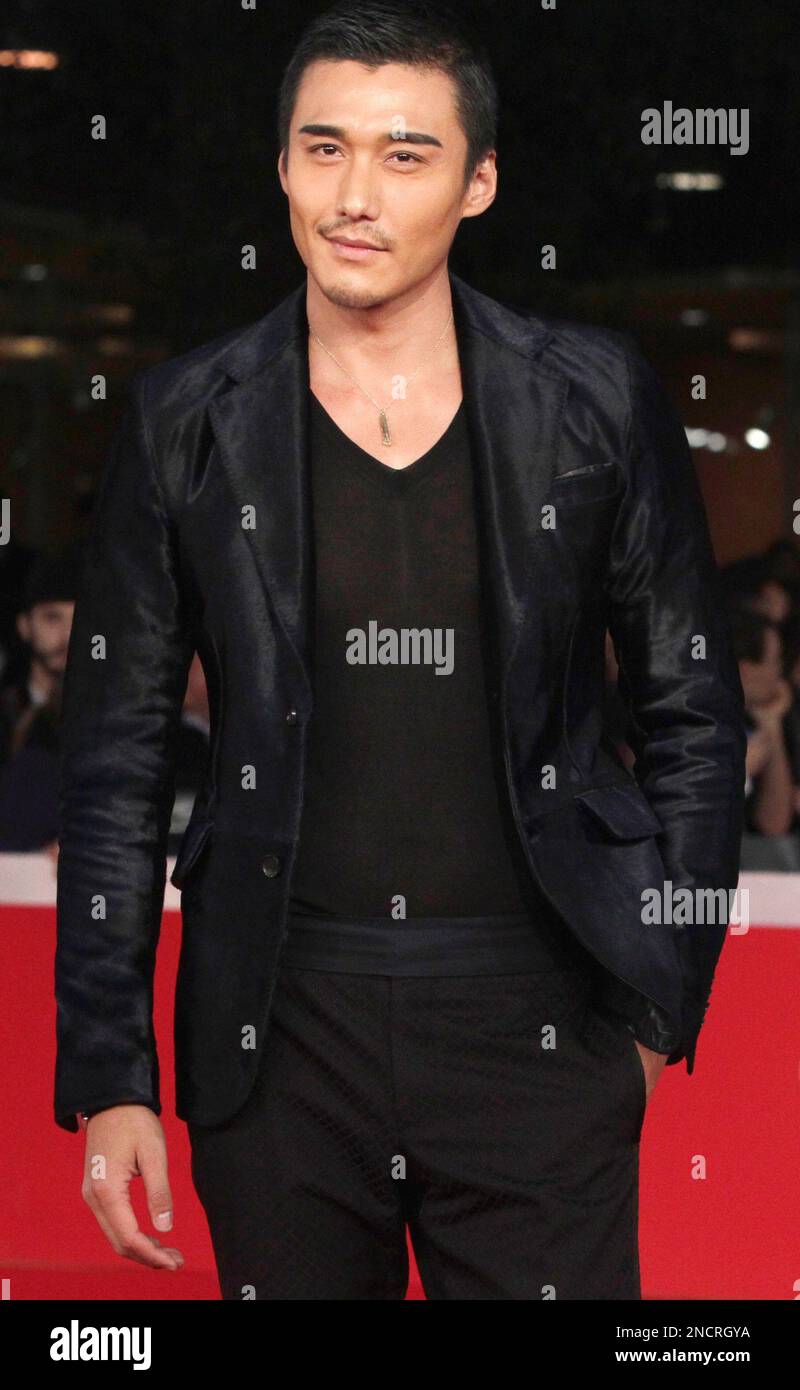 Chinese actor Hu Bing walks on the red carpet to attend the screening ...