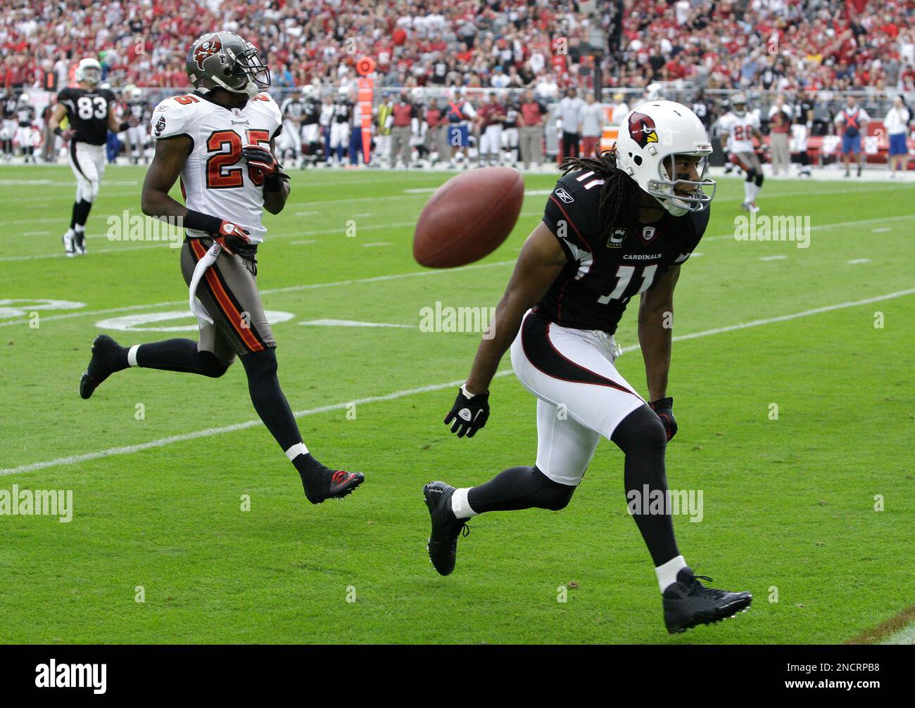 Arizona Cardinals' Larry Fitzgerald (11) is unable to catch the ball thrown  to him as Tampa Bay Buccaneers' Aqib Talib (25) comes in to defend during  an NFL football game Sunday, Oct.
