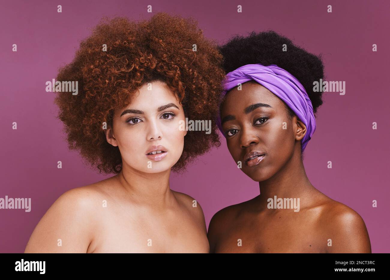 Black woman, studio portrait and afro for friends, beauty or glow for natural aesthetic by purple background. Gen z model, makeup women and solidarity Stock Photo