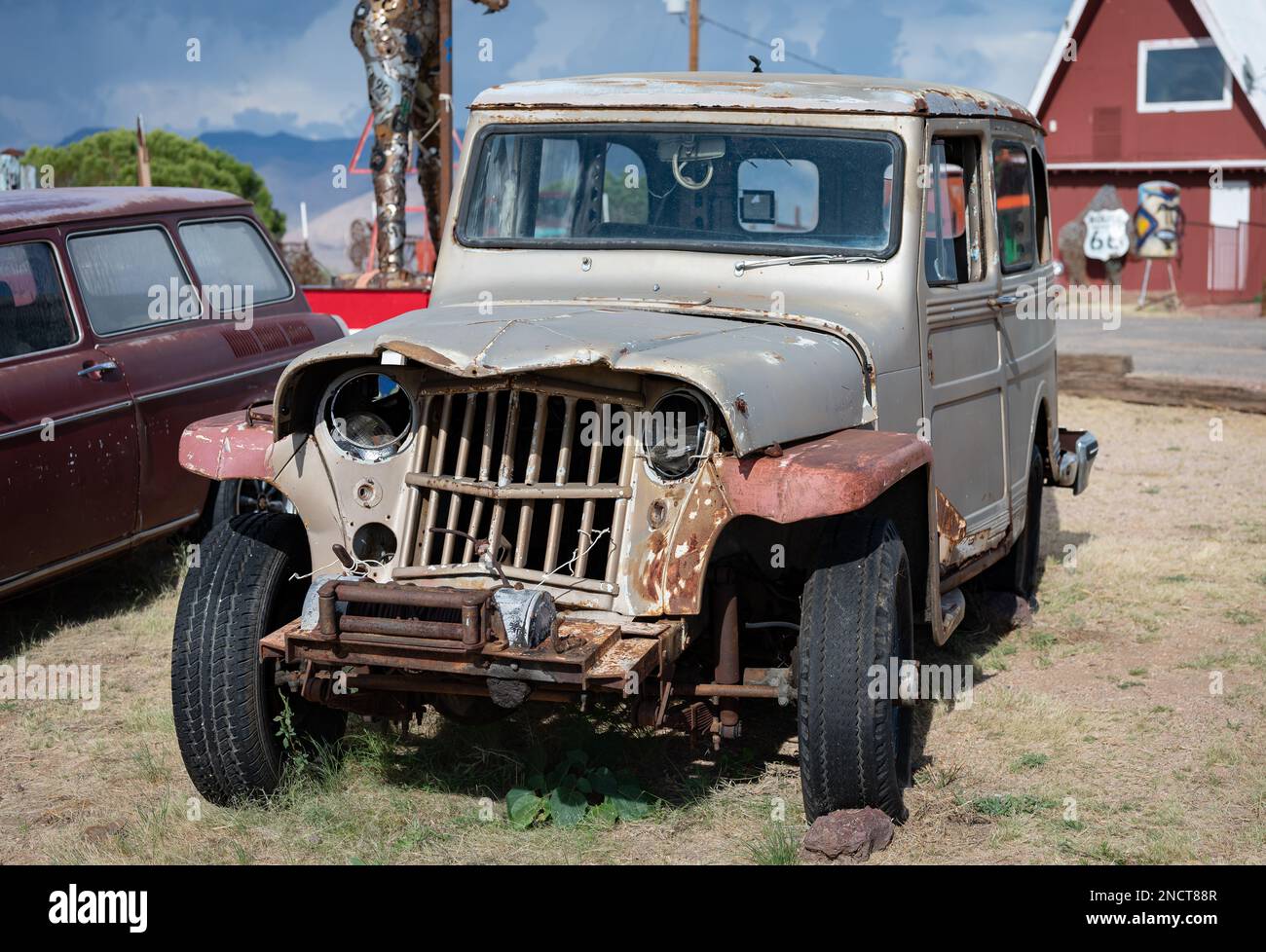 A Former SUV Willys Jeep Station Wagon is damaged in the front with a blow to the radiator grill Stock Photo