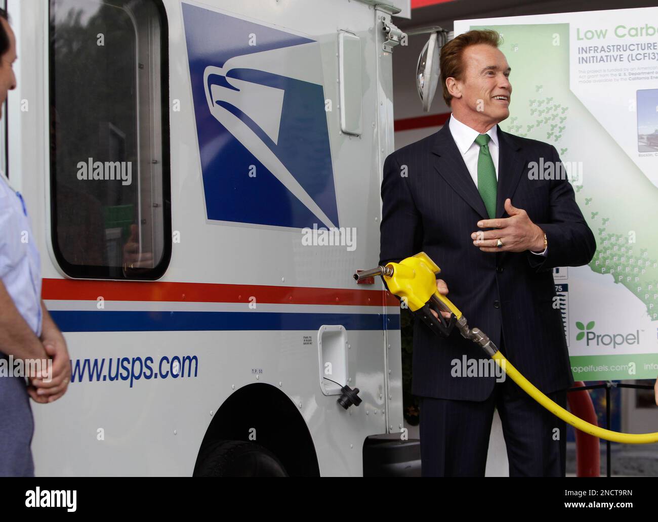 Calif. Gov. Arnold Schwarzenegger pumps a special Flex Fuel (E85), a
