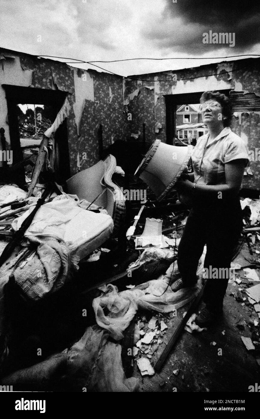 Debra of Silver Spring, Maryland, begins salvaging at the home