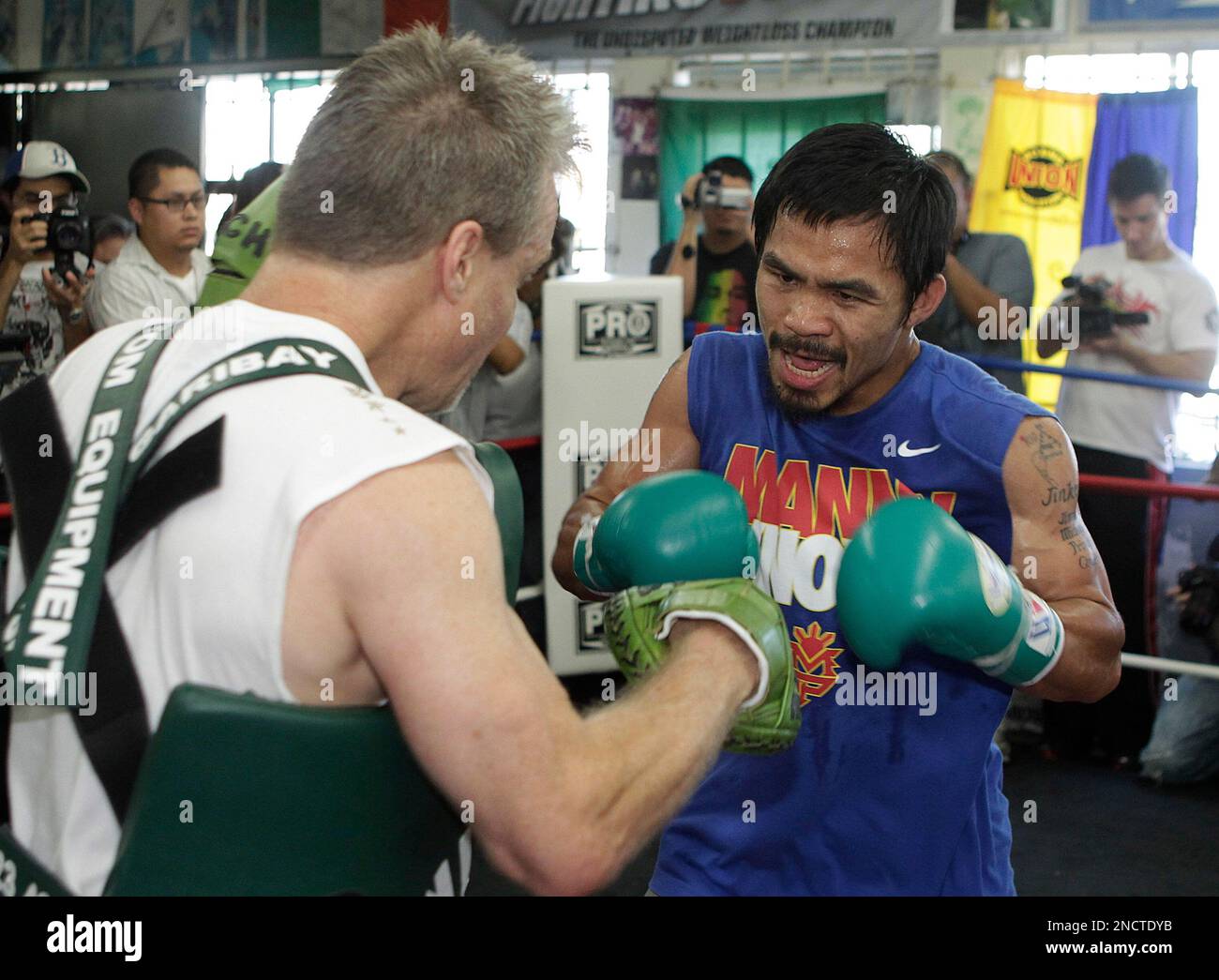 Boxer Manny Pacquiao, right, of the Philippines, trains with Freddie Roach for his upcoming boxing match with Antonio Margarito at the Wild Card Gym in Los Angeles, Wednesday, Oct