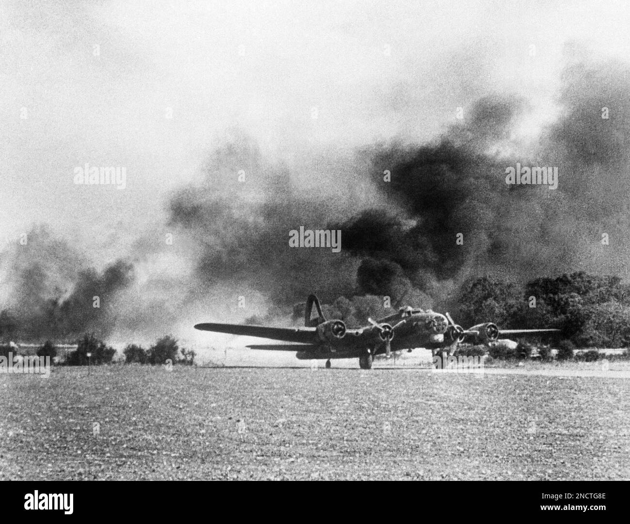 An American Flying Fortress, just returning from the raid on the ball ...