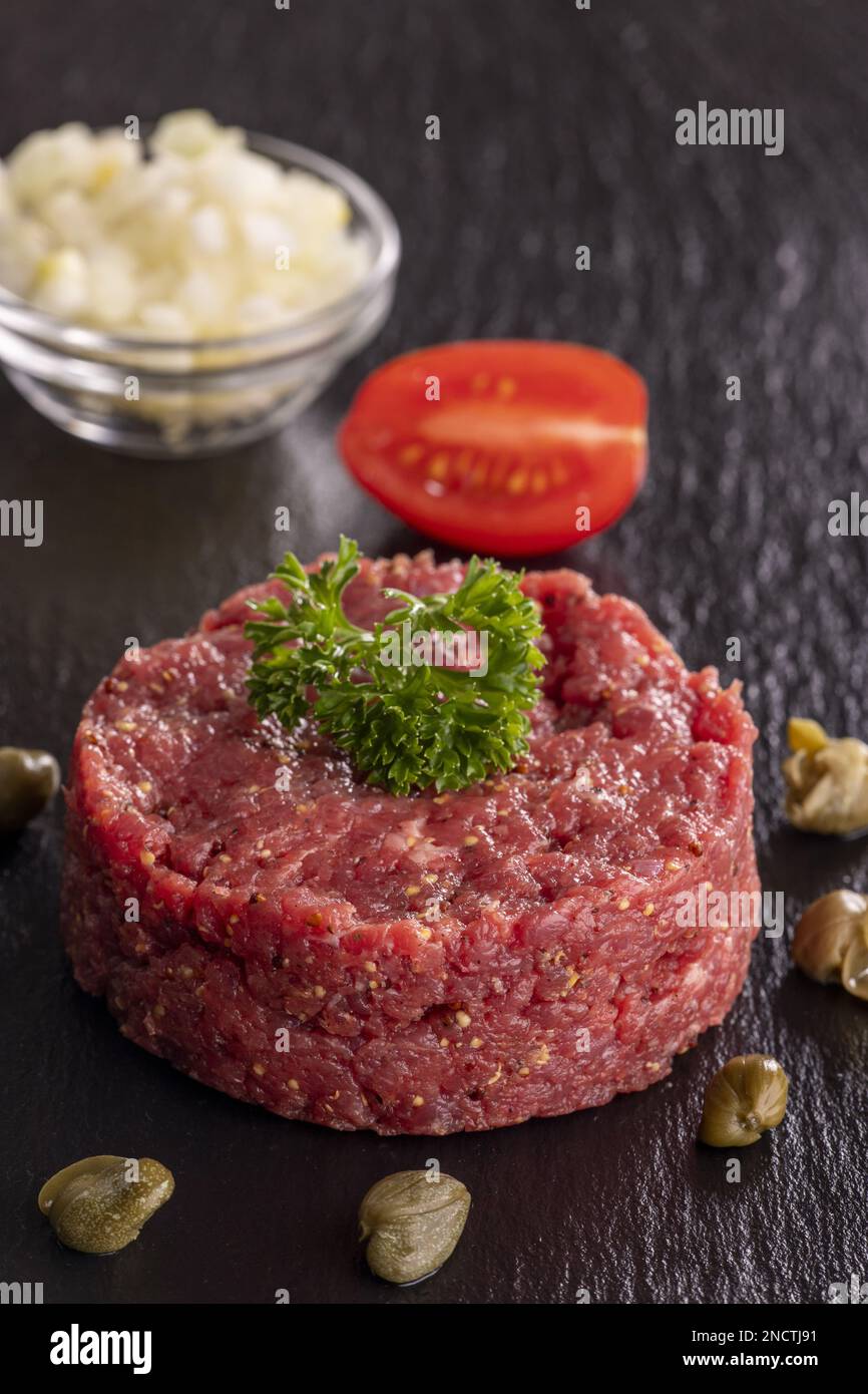 Steak Tartare On Black Slate Stock Photo Alamy