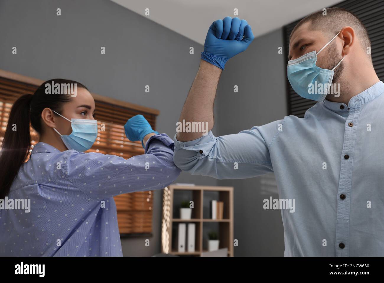 Man woman in masks bumping hi-res stock photography and images - Alamy
